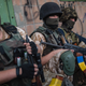 Ukrainian government soldiers take a breather in eastern Ukraine during a lull in the fighting in 2014. Photo credit: AP